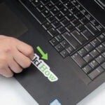 How to remove laptop stickers without damaging them?