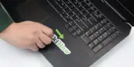 How to remove laptop stickers without damaging them?